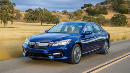 Three-quarter front view of a 2017 blue Honda Accord hybrid