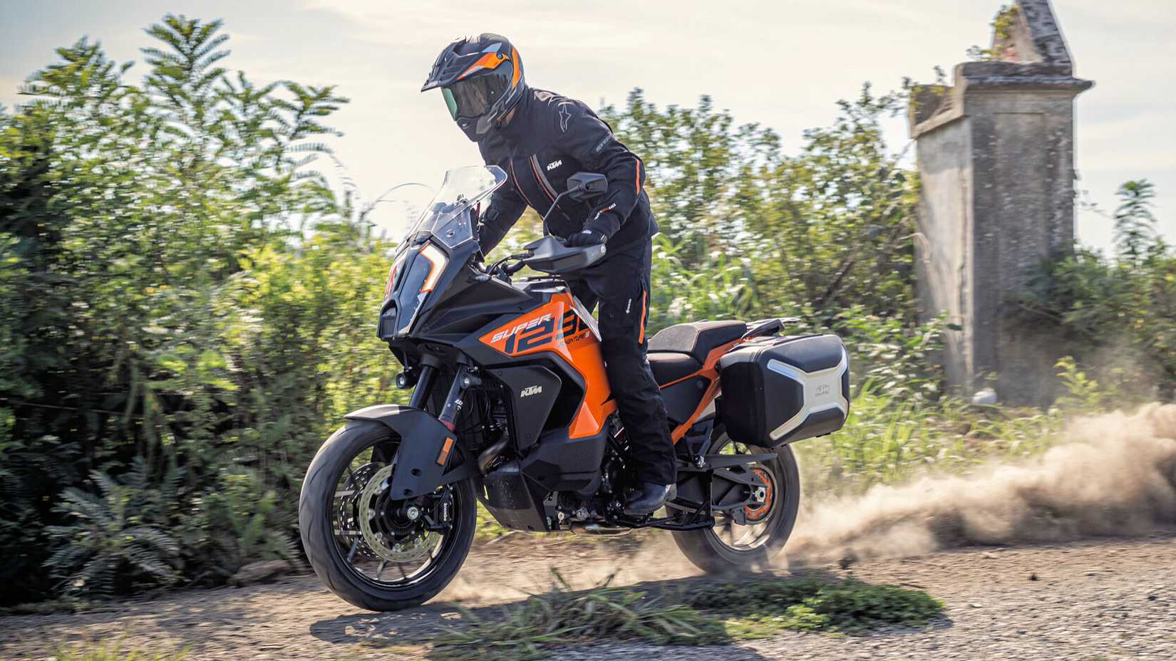 2023 KTM 1290 Super Adventure S cruising on a dirt trail