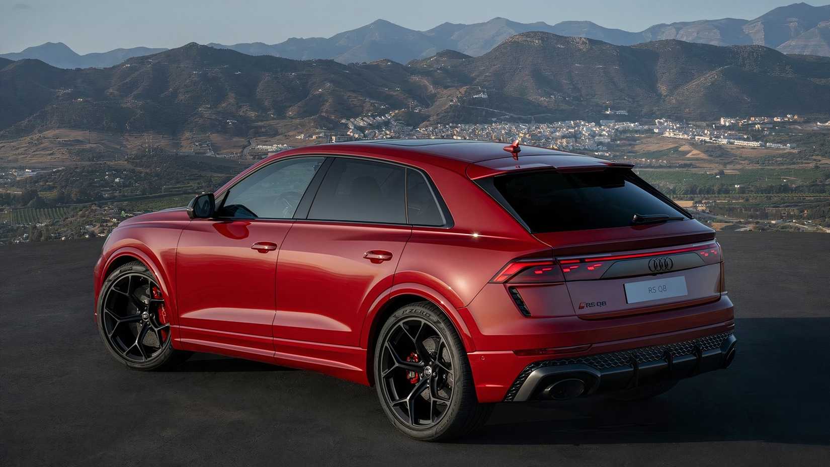 Rear three-quarter view of a red Audi RS Q8 performance