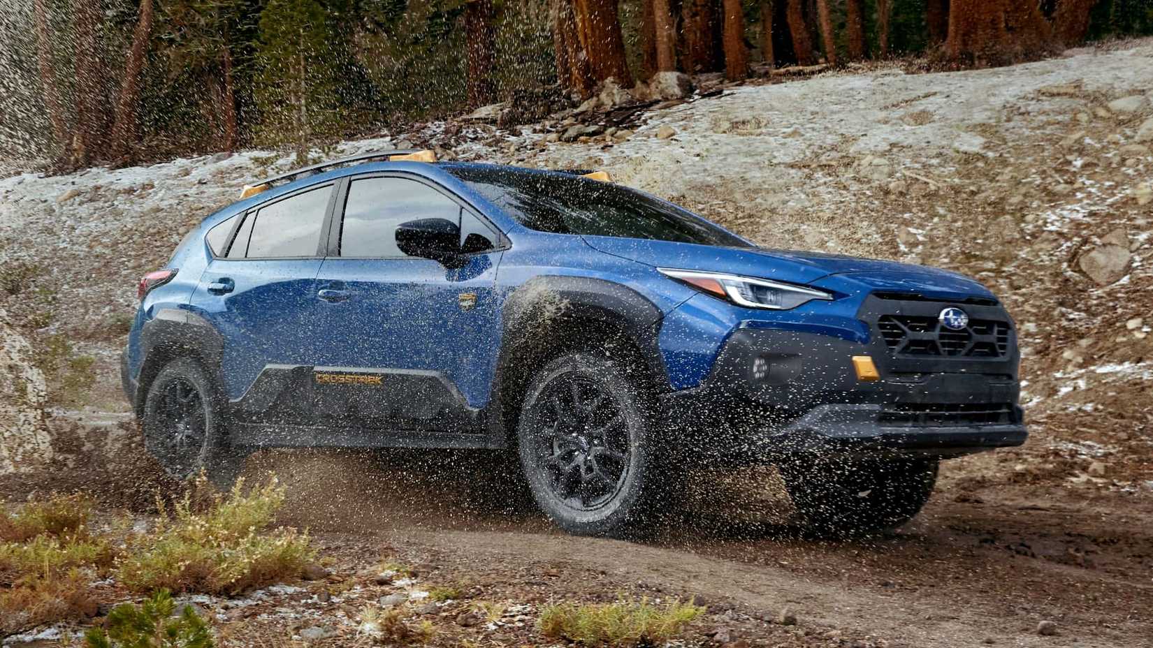 Subaru Crosstrek Wilderness front 3/4 shot driving through mud