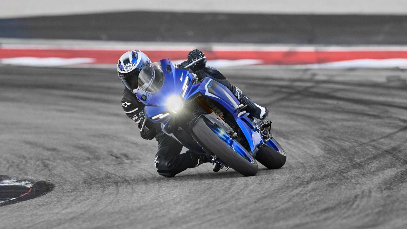 Yamaha YZF-R3 on the racetrack cornering front fascia view