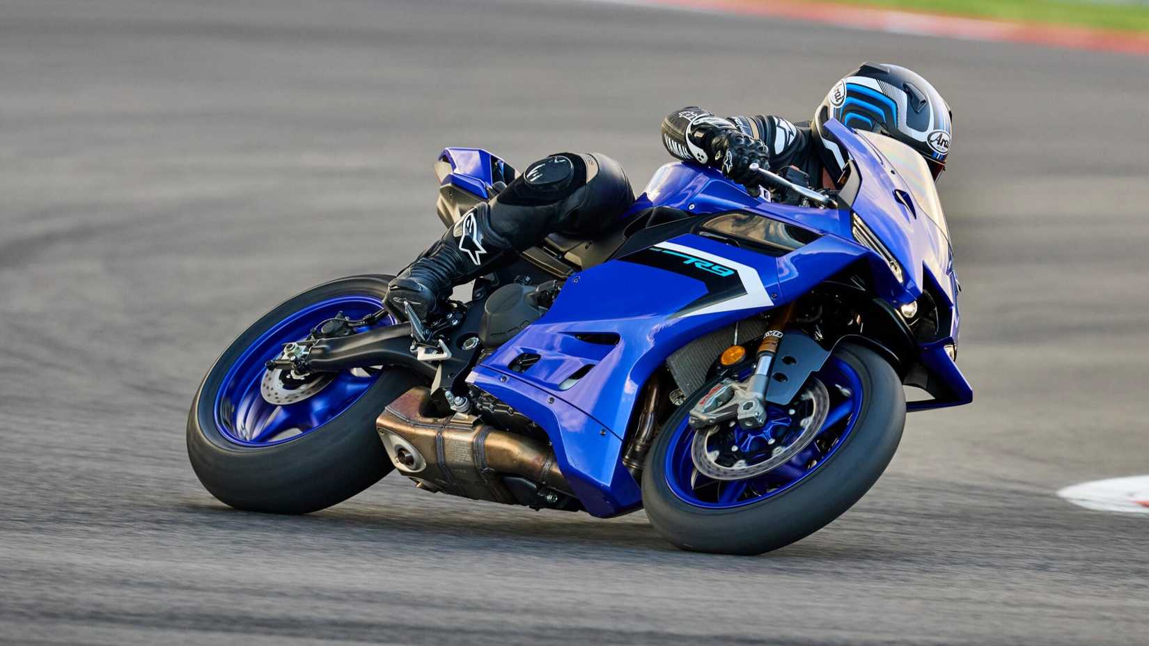 2025 Yamaha YZF-R9 cornering on a racetrack side profile view