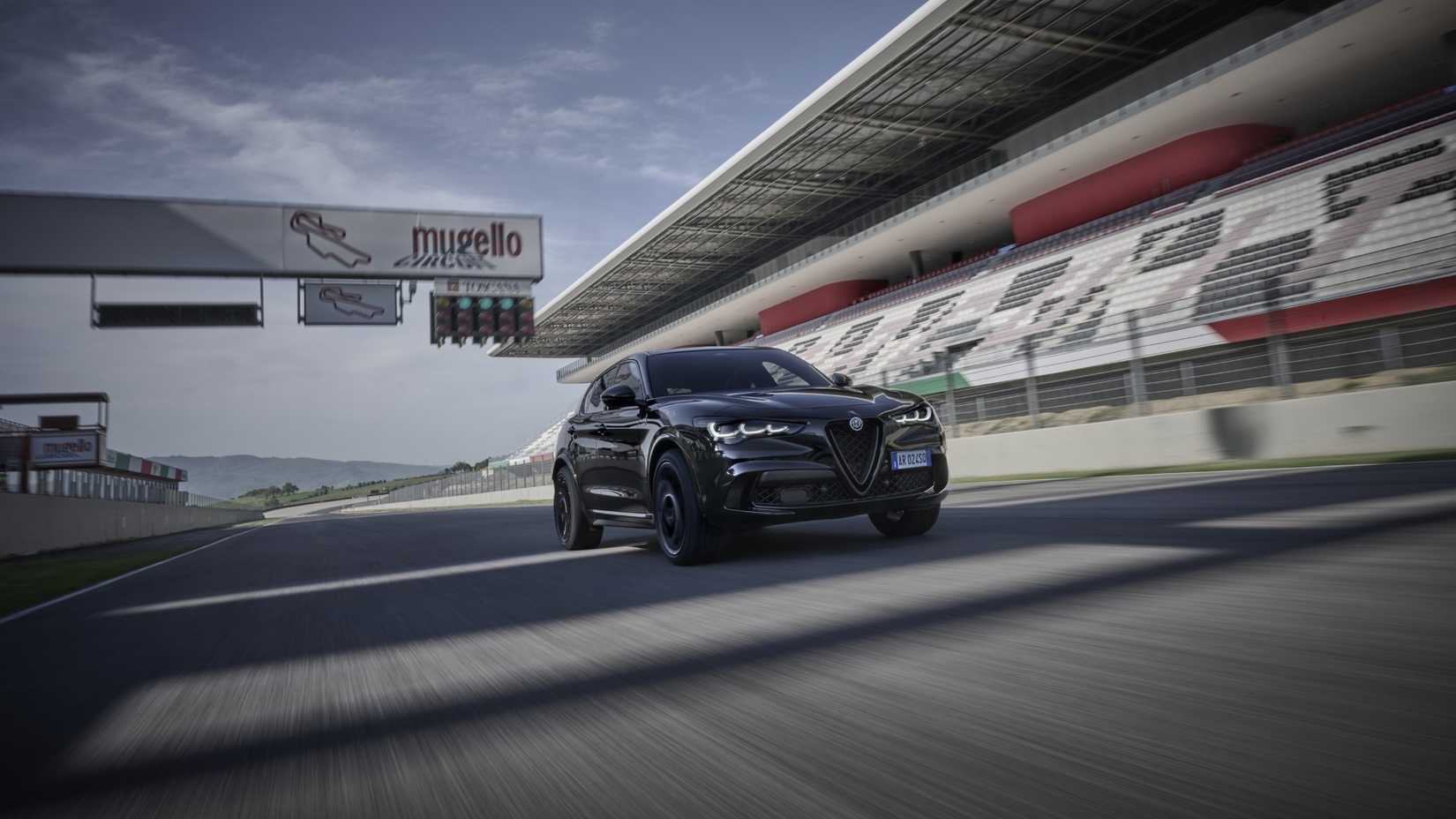 Front 3/4 action shot of a 2024 Alfa Romeo Stelvio Quadrifoglio 