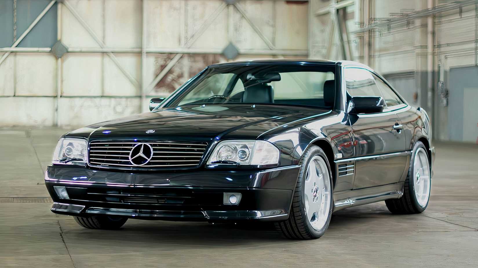 1996 Mercedes-Benz SL73 AMG in black posing in warehouse