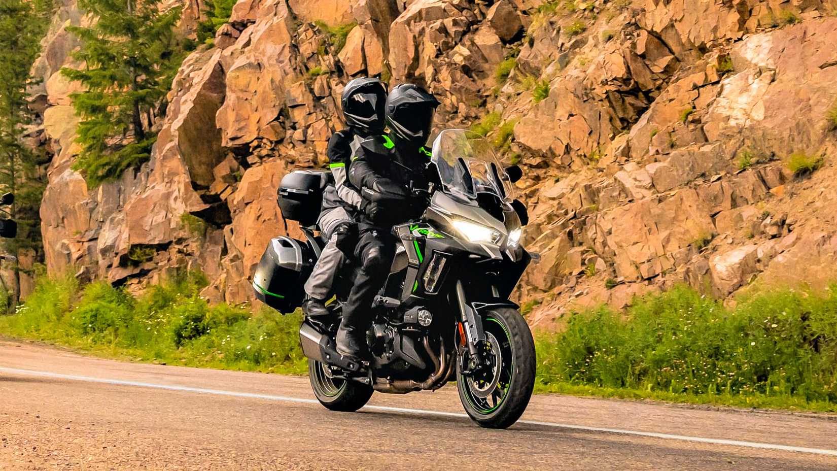 Rider and passenger on an accessorized 2025 Kawasaki Versys 1100 SE LT
