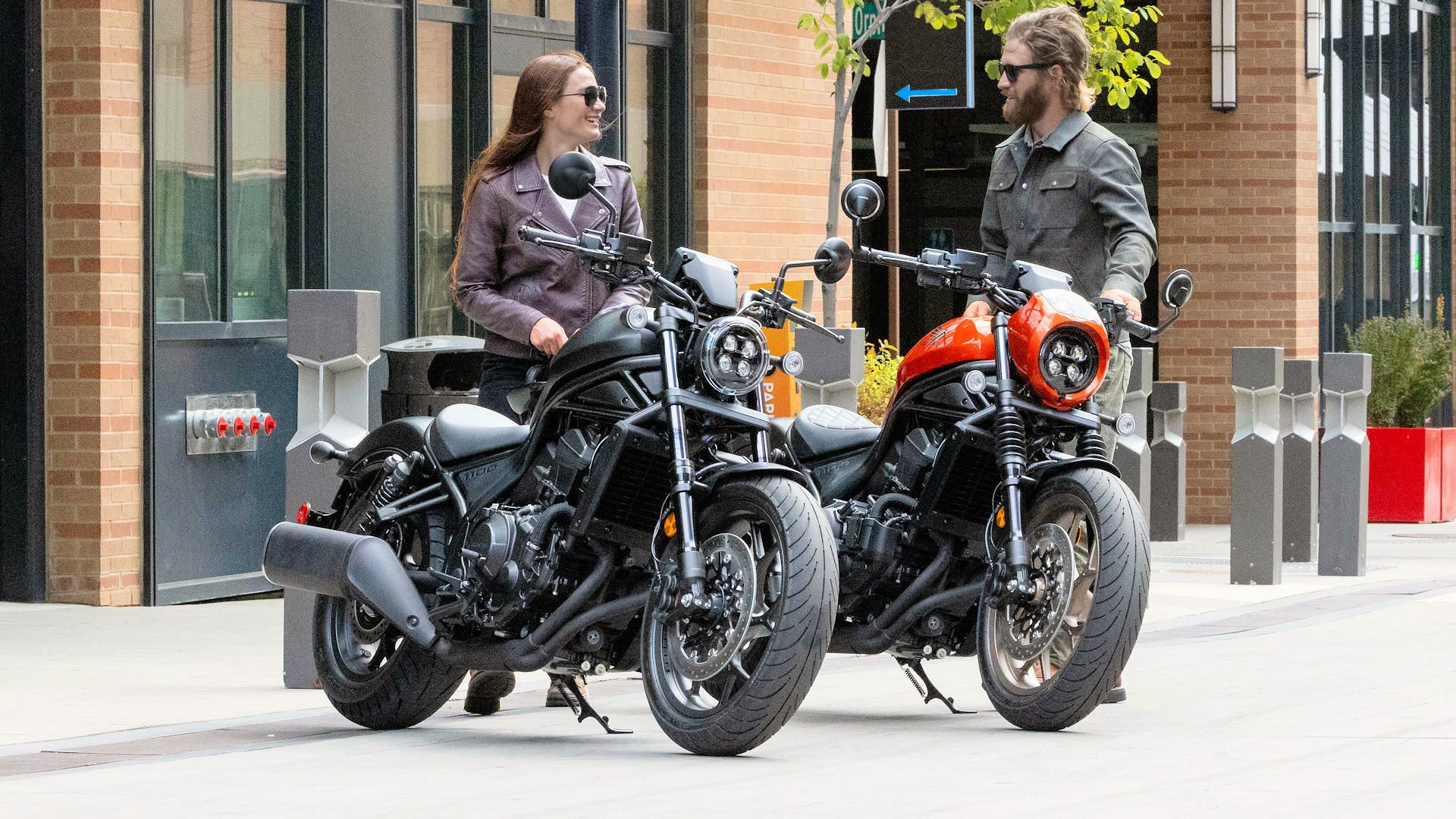 Riders next to a pair of 2025 Honda Rebel 1100 motorcycles