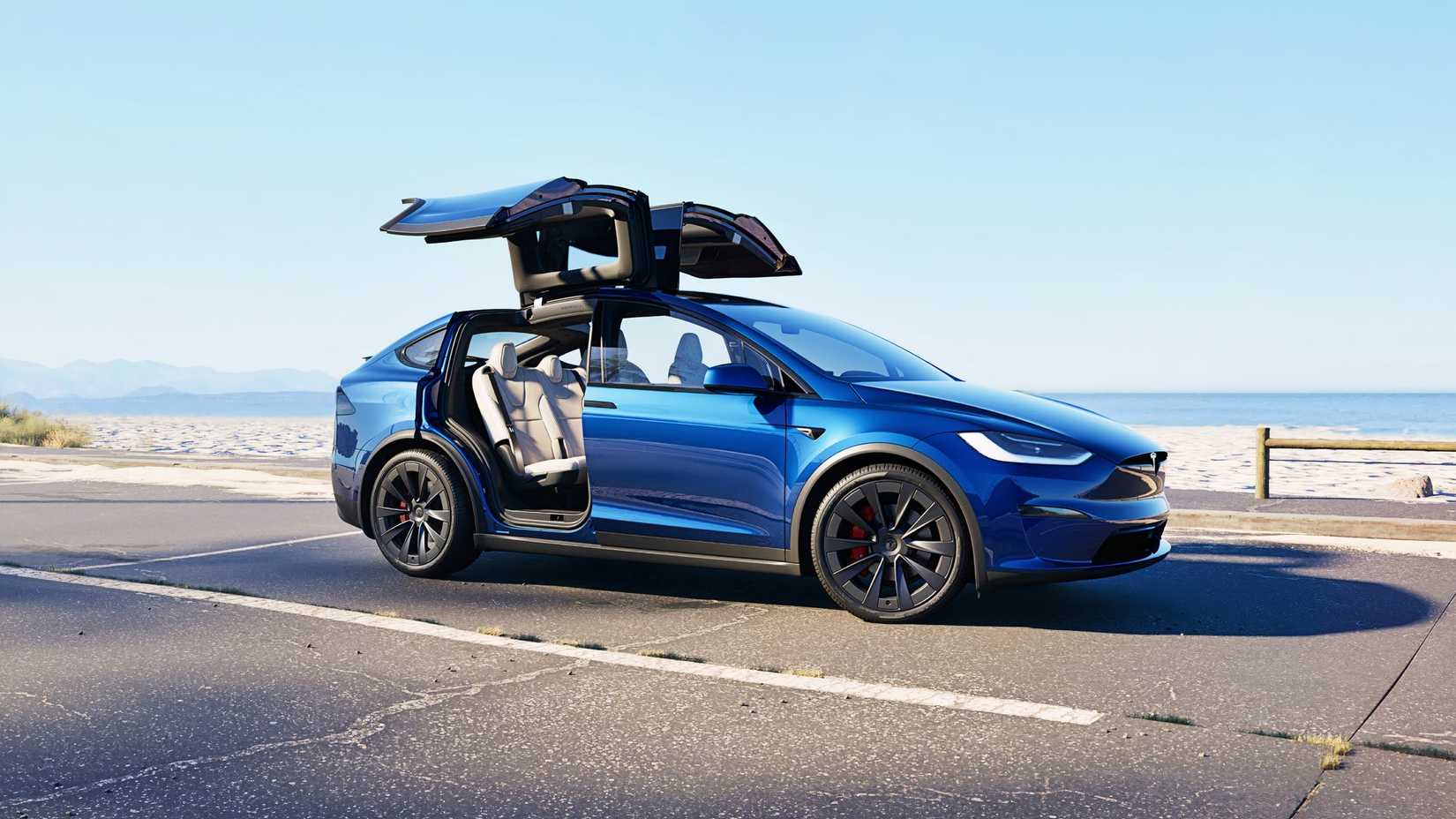 A blue Tesla model x medium -sized SUV.