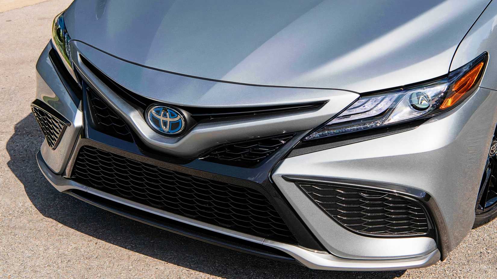 The front of a gray 2022 Toyota Camry Hybrid.