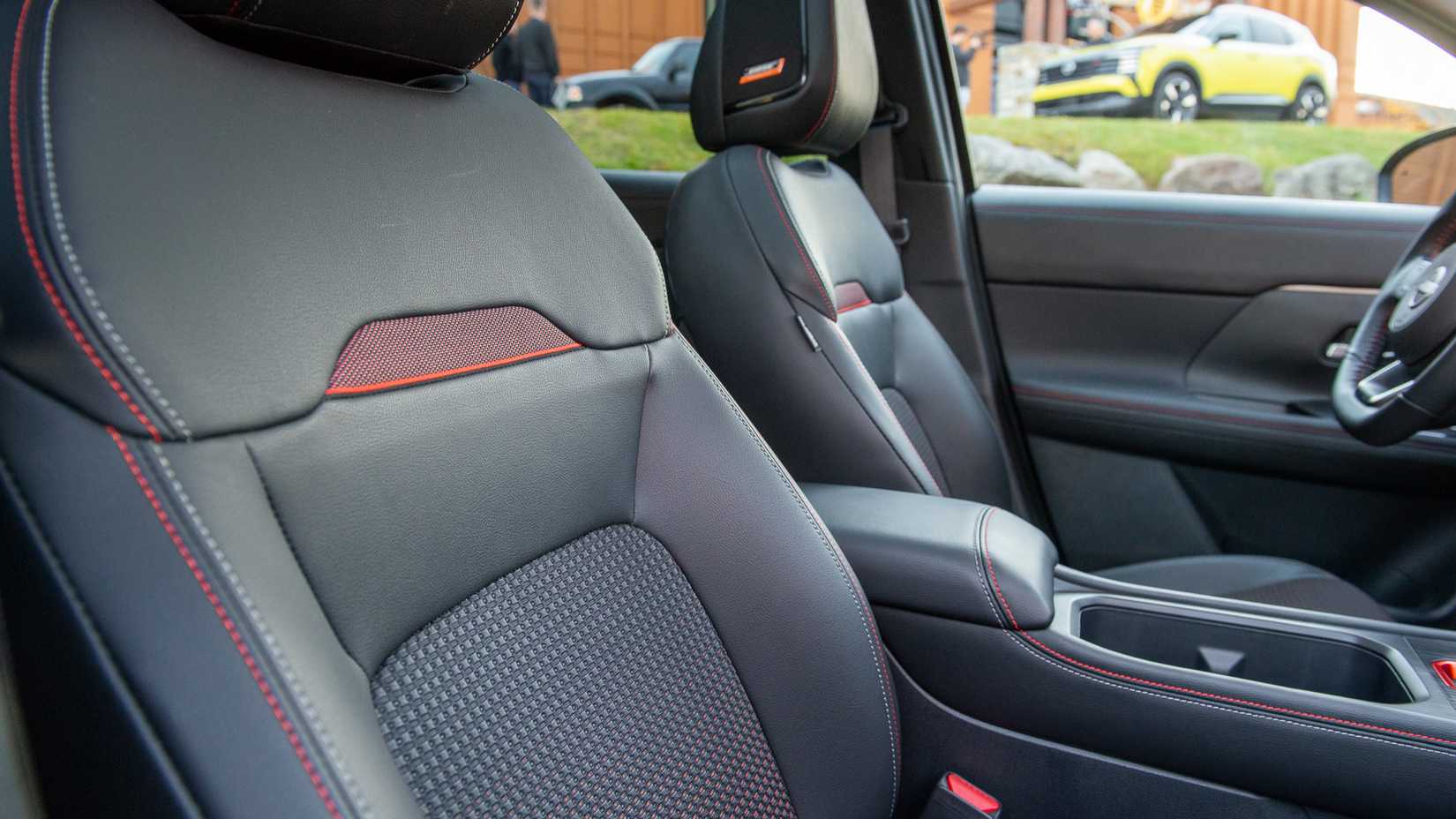 2025 Nissan Kicks SR AWD interior showing front seats