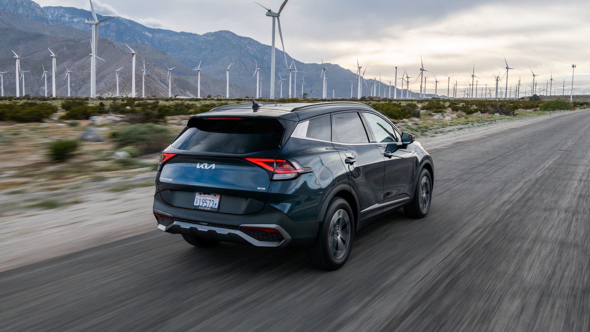 A rear three-quarter view of a 2025 Kia Sportage Hybrid