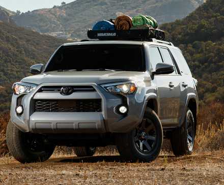 2021 Toyota 4Runner in silver parked off-road with roof bars loaded up