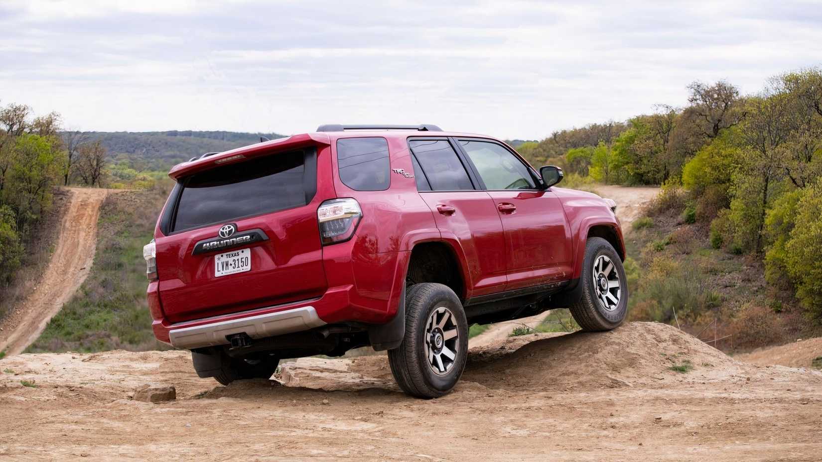 Rear 3/4 shot of a 2019 Toyota 4Runner driving off-road