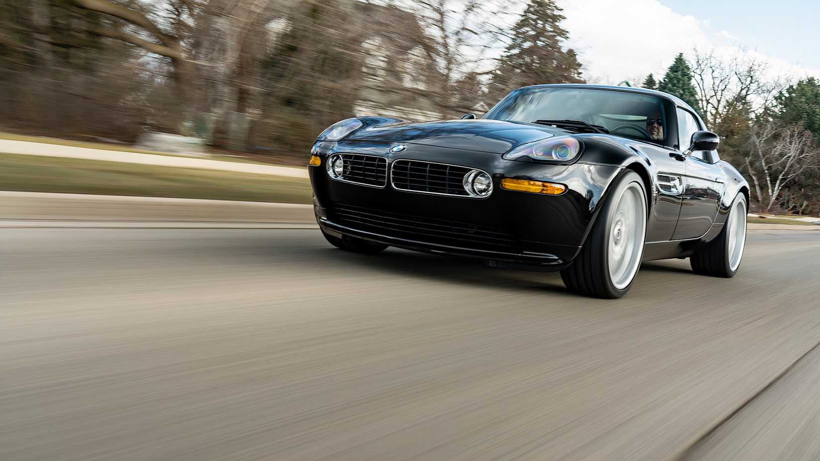 Low angle front 3/4 shot of 2003 BMW Z8 in black driving on road