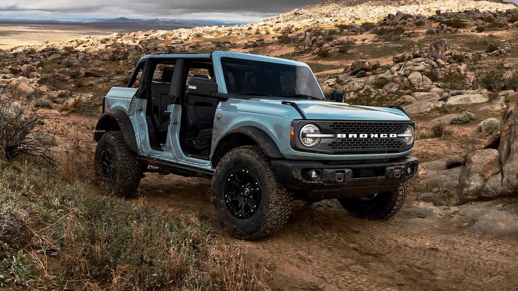2021 Ford Bronco Badlands in blue driving off road in desert
