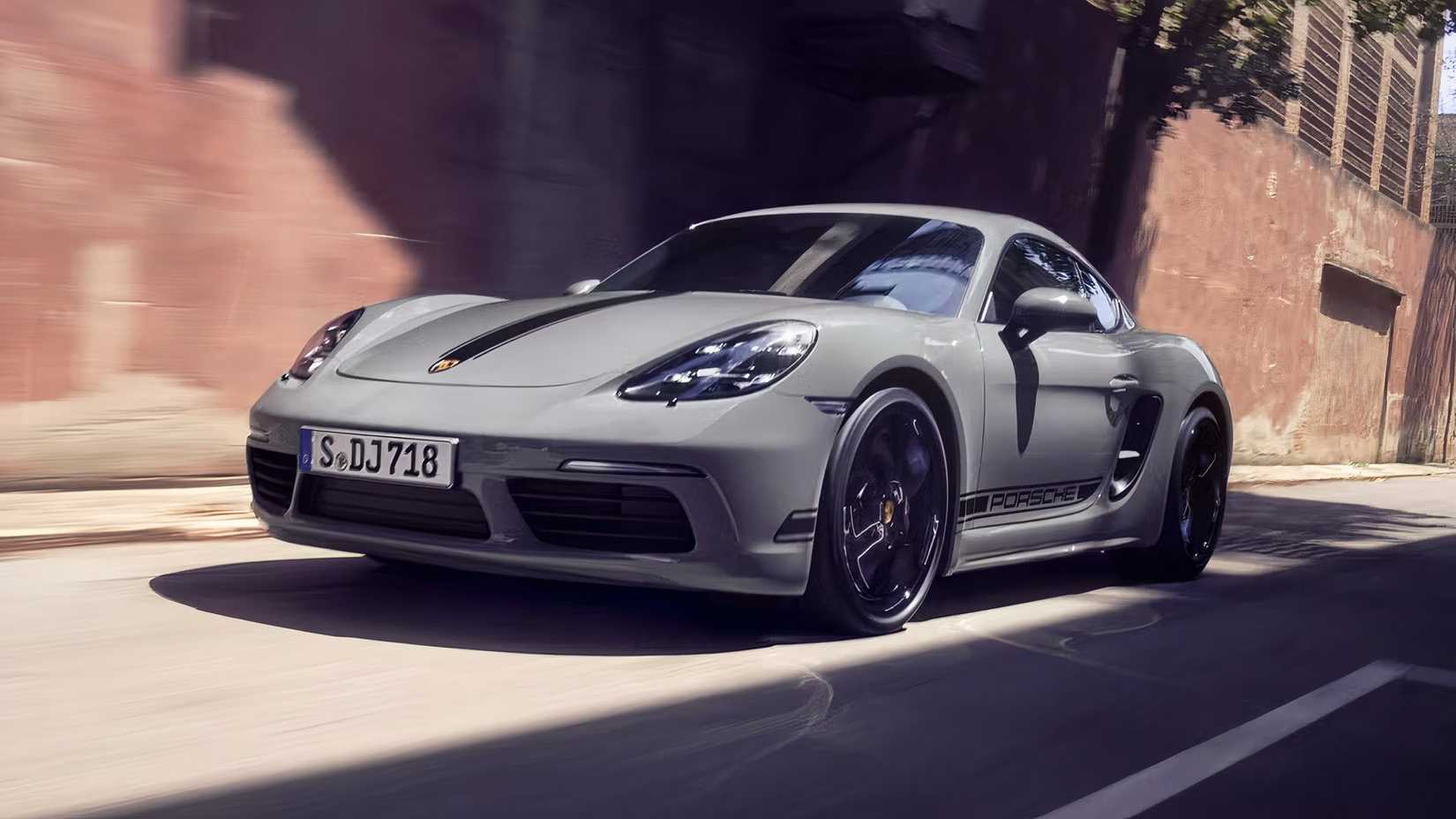 2025 Porsche 718 Cayman in gray driving along city street