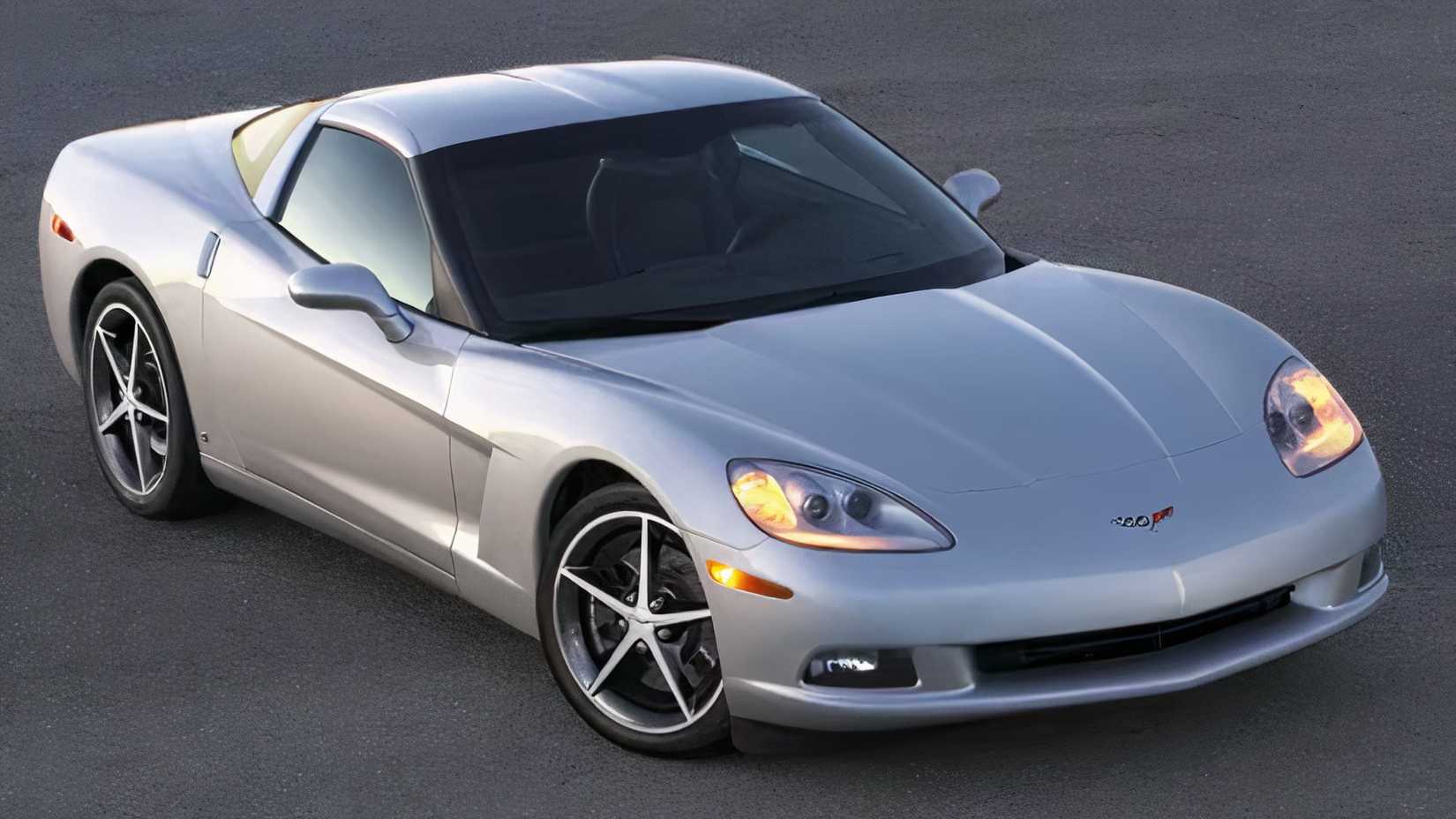 2011 Chevrolet Corvette in silver posing on the road