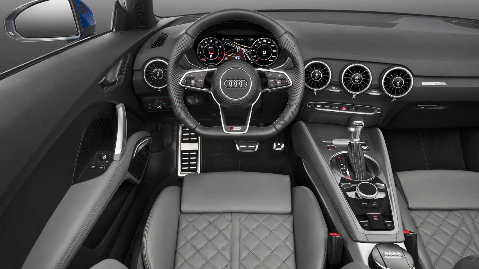 2016 Audi TT 2.0 Quattro interior showing cabin, steering wheel, dash, and central console