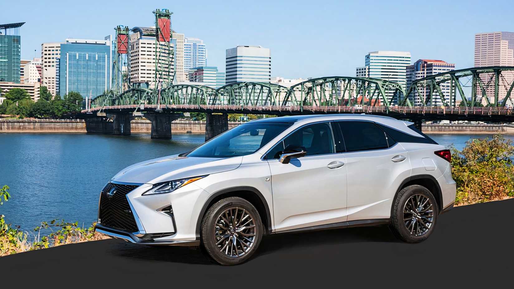 A white Lexus RX 450h midsize hybrid SUV. 