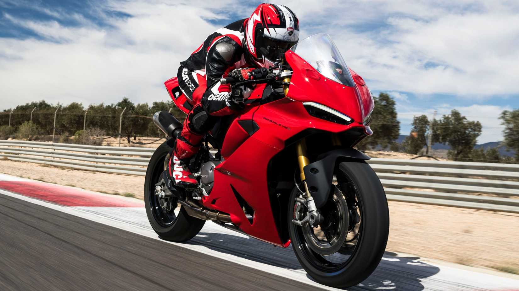 2025 Ducati Panigale V2 flat out on a racetrack front third quarter view