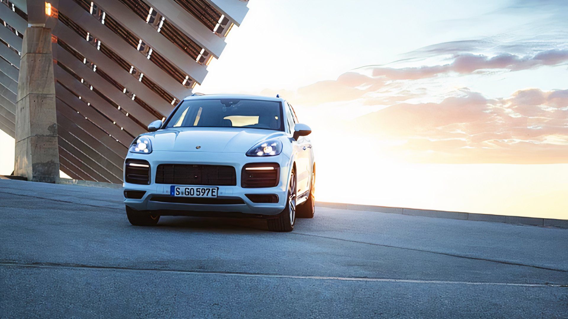 A white 2019 Porsche Cayenne E Hybrid is parked. 