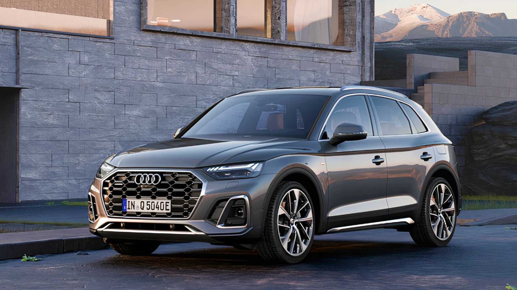 A gray 2022 Audi Q5 TSFI e plug-in hybrid SUV is parked. 