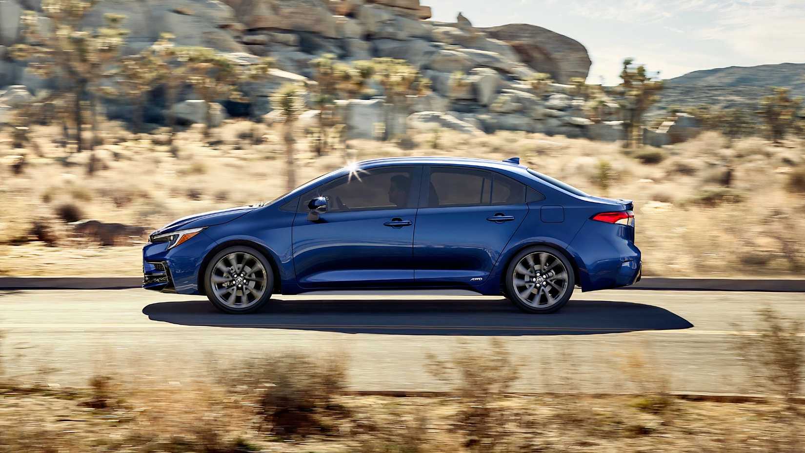 Side profile shot of a blue 2025 Toyota Corolla Hybrid in action
