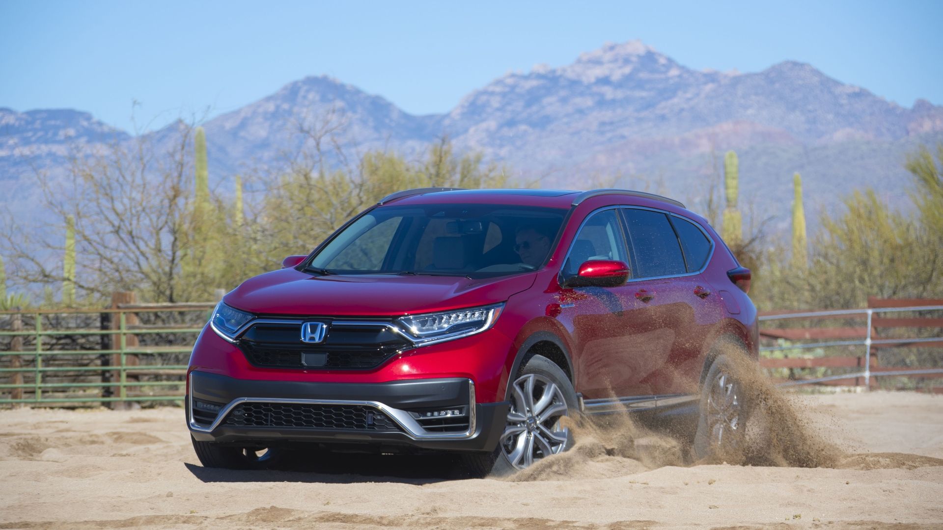 Front 3/4 action shot of a 2020 Honda CR-V Hybrid