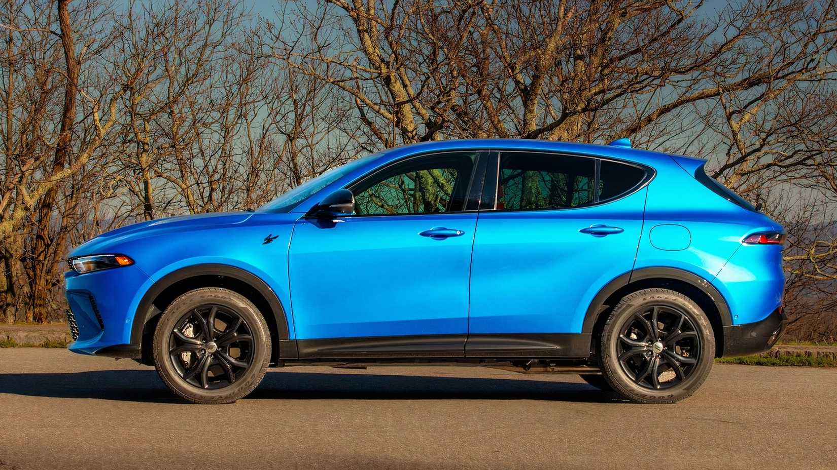 A side-profile view of a blue Dodge Hornet