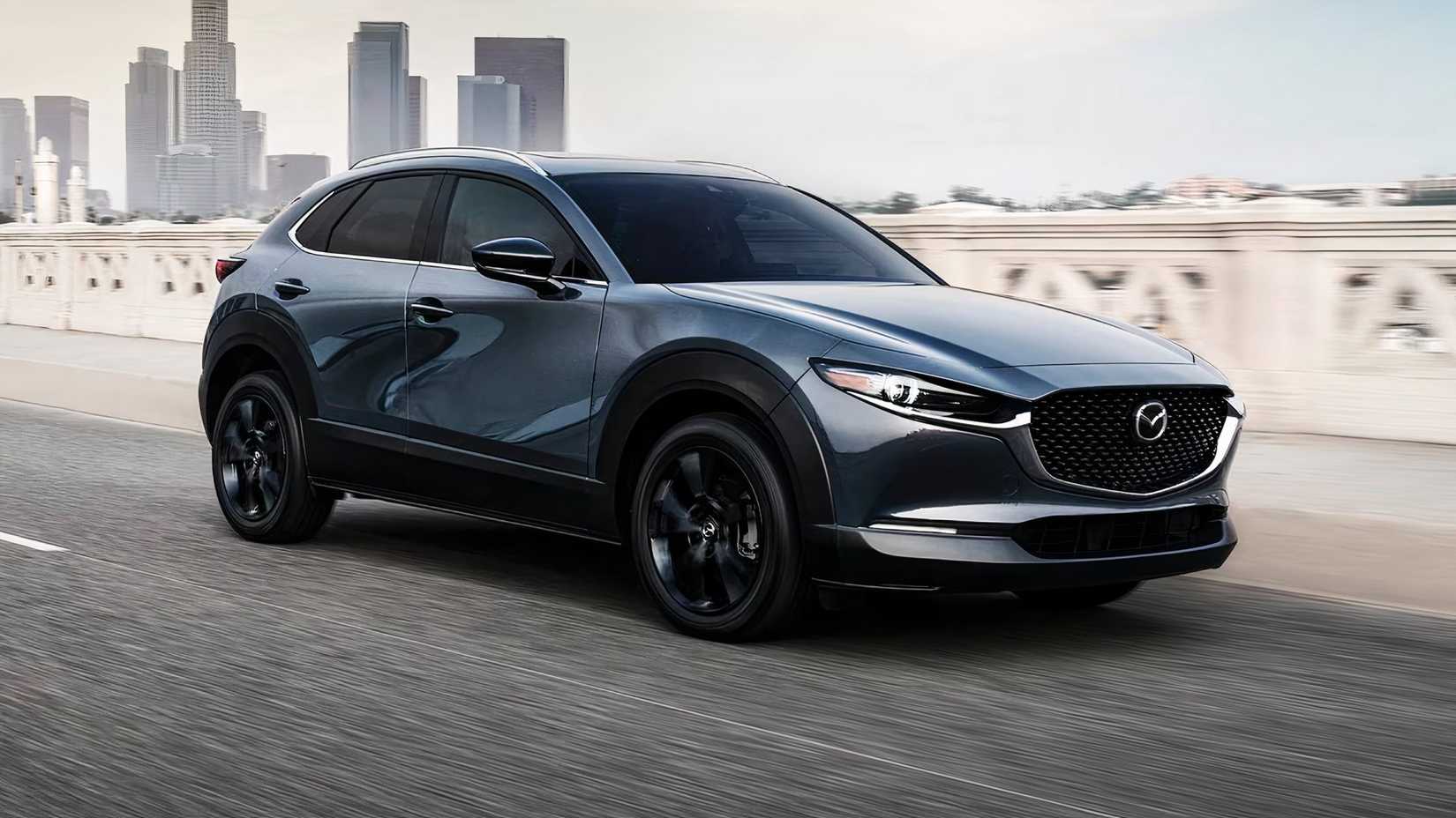 2025 Mazda CX-30 2.5 Turbo Premium Plus in gray driving on city road