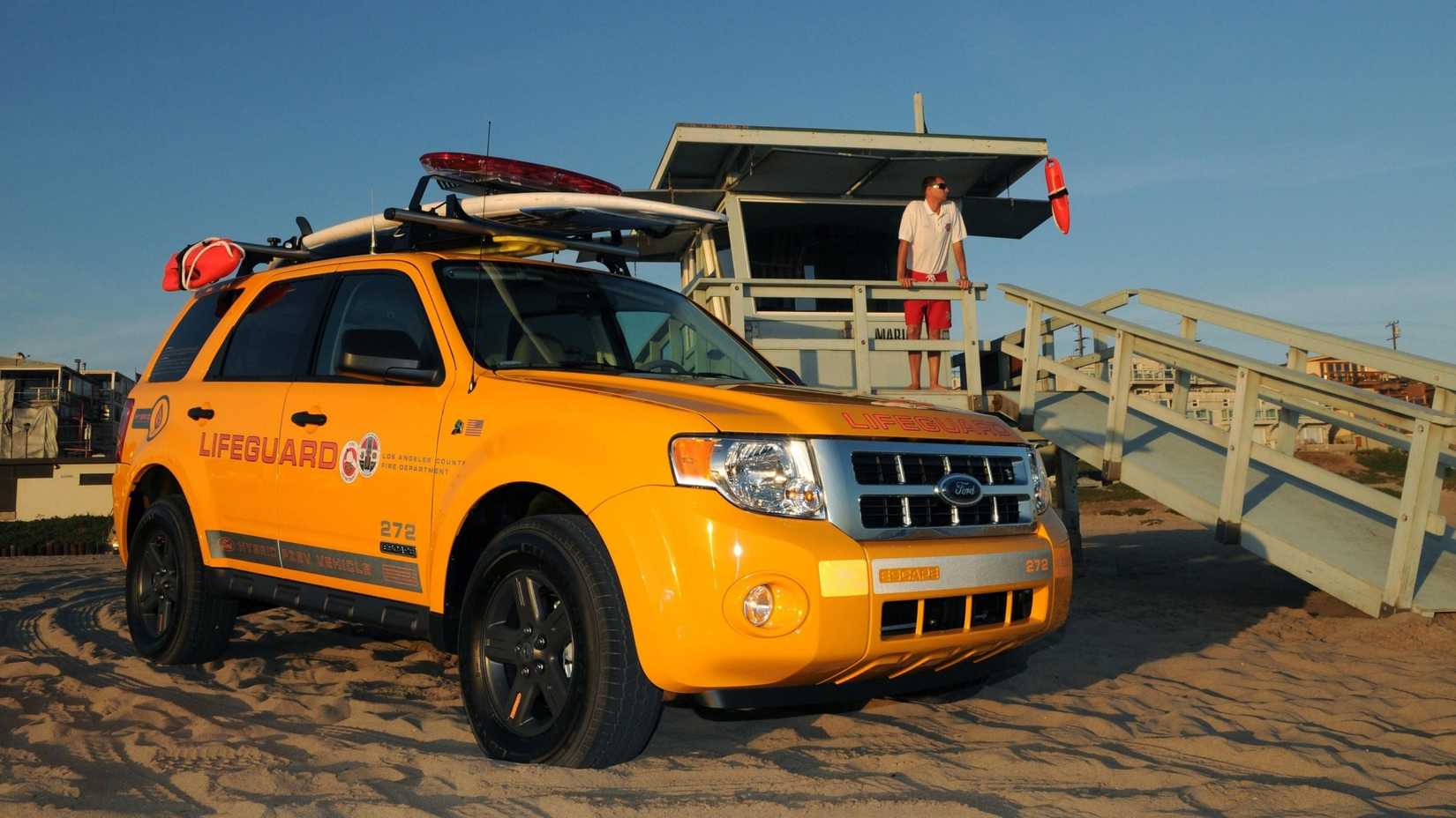 2008 Ford Escape Hybrid Lifeguard front 3/4 shot parked on beach