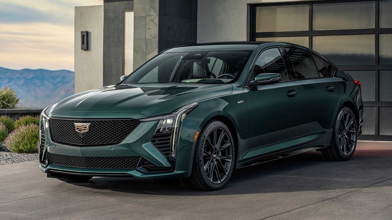 2025 Cadillac CT5-V in green posing outside of house
