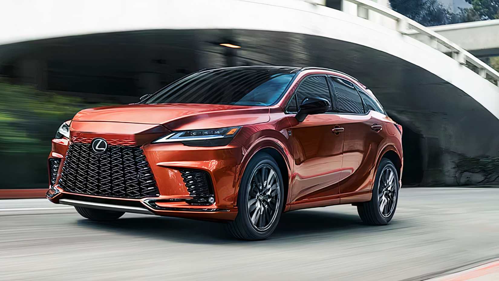 An orange 2025 Lexus RX Plug In Hybrid midsize plug-in hybrid SUV.
