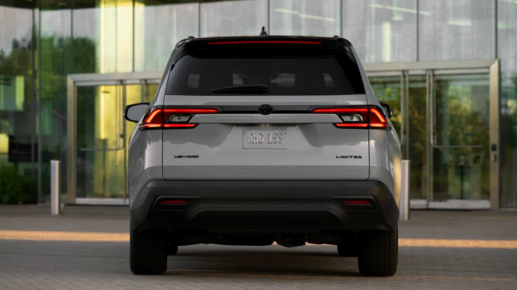 2025 Toyota Grand Highlander Rear shot parked in front of a building