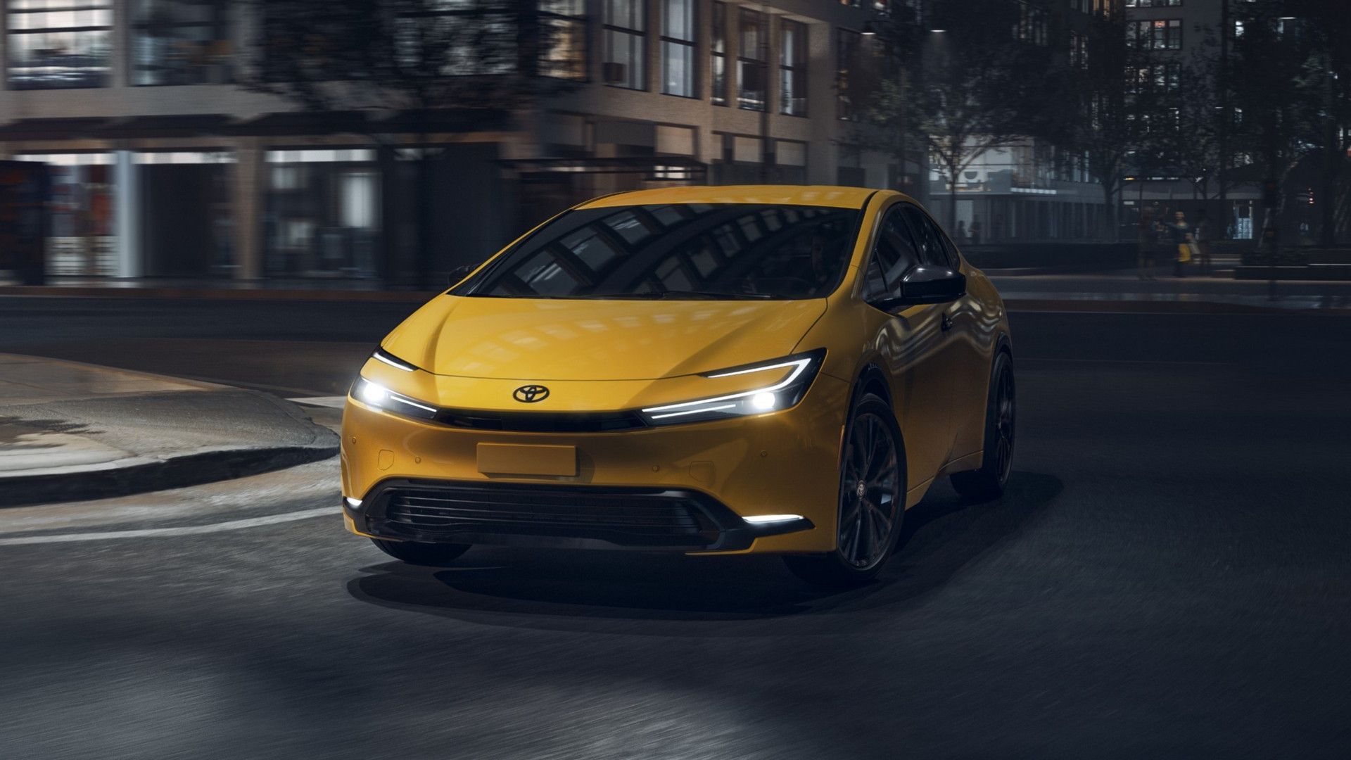 2025 Toyota Prius Nightshade in yellow driving on city street