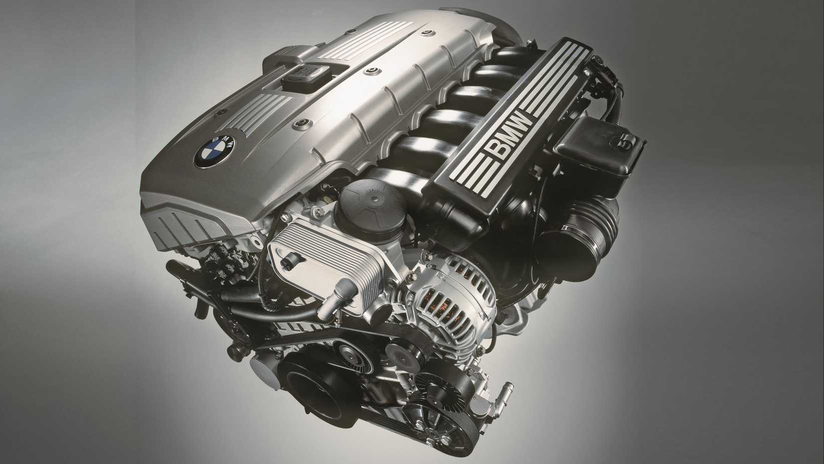 BMW inline-six engine closeup, plain background
