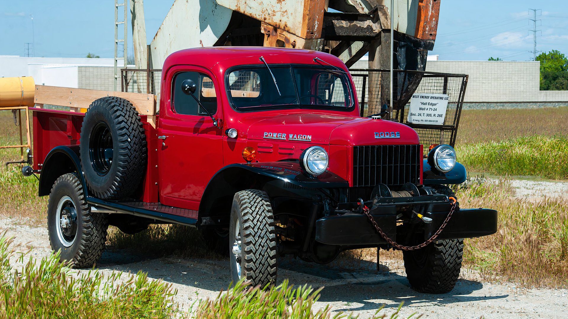 1948 Dodge Power Wagon in red parked in industrial park