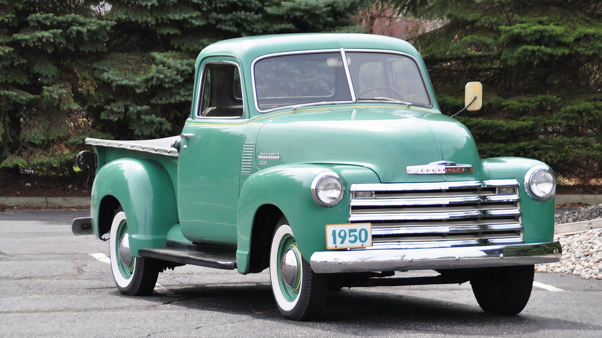 1950 Chevrolet 3100 in green parked in parking lot