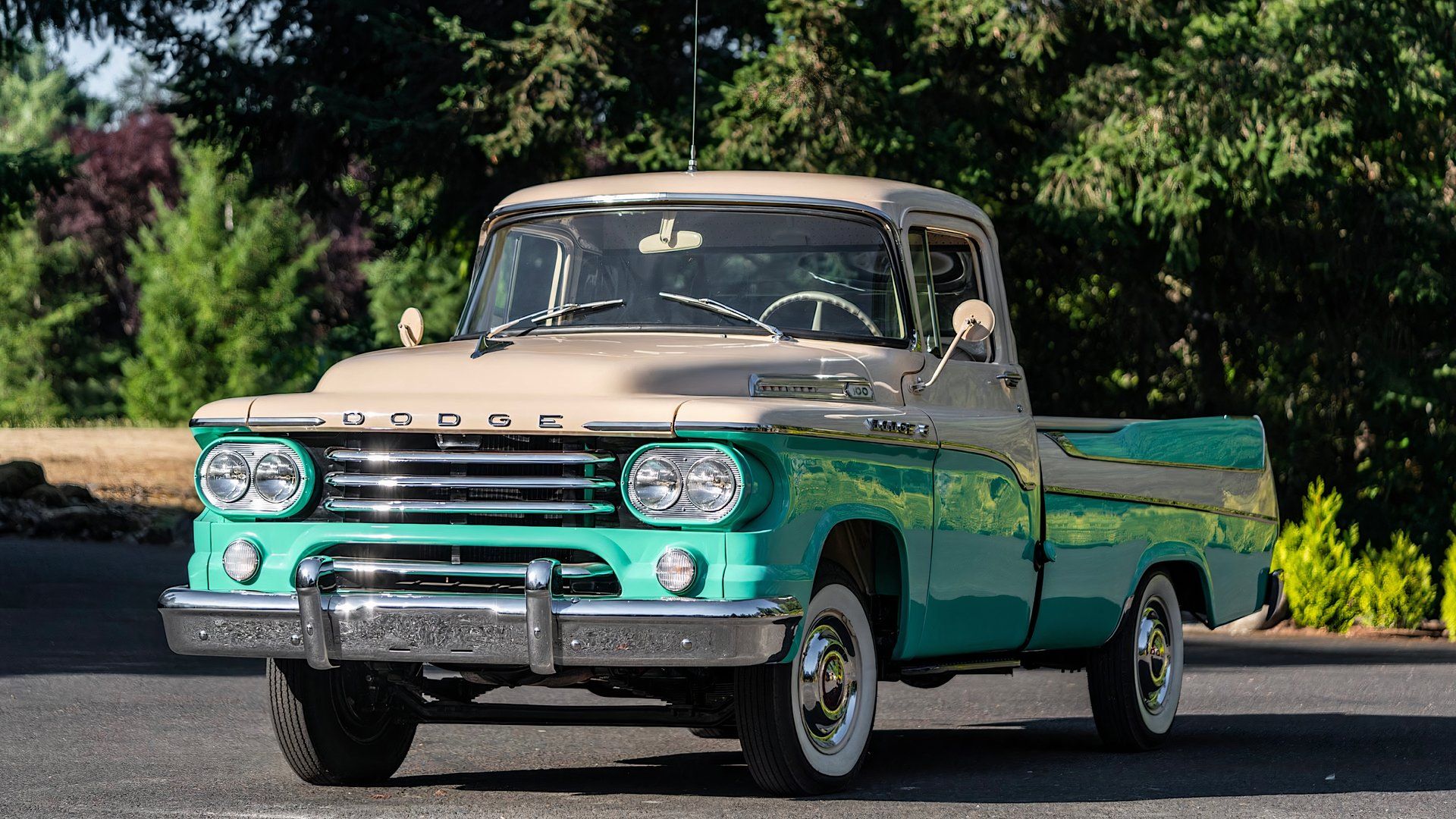 1958 Dodge Sweptside in green and white parked in parking lot