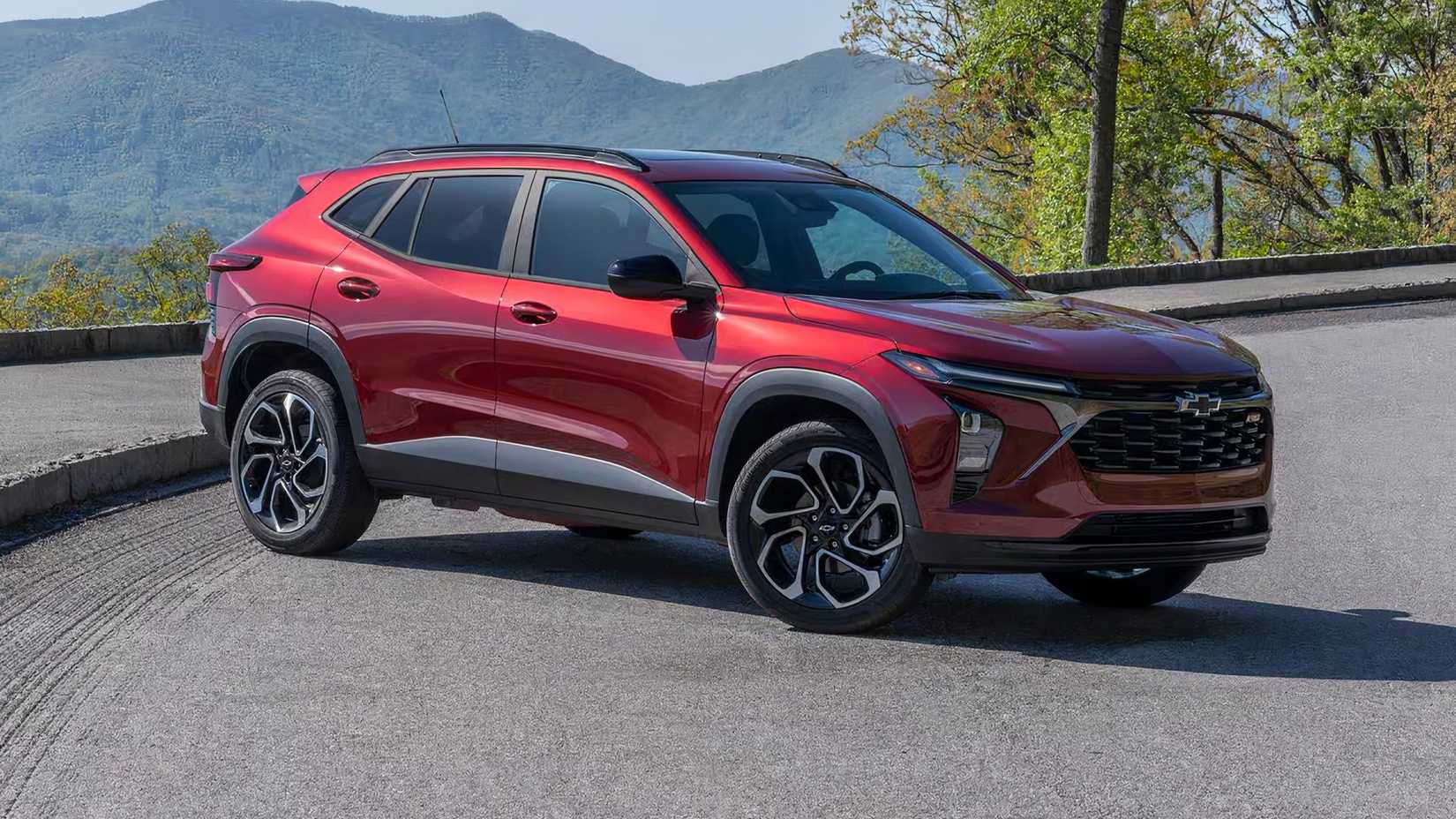 2024 Chevrolet Trax 2RS in red parked in front of mountain range