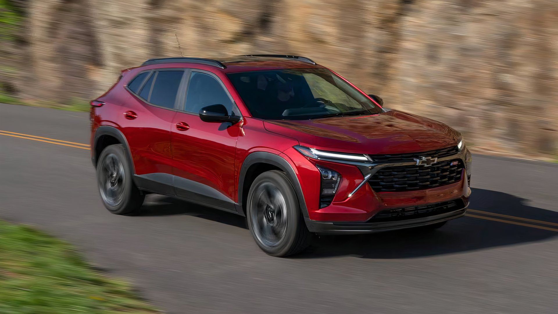 2024 Chevrolet Trax 2RS in red driving on mountain road