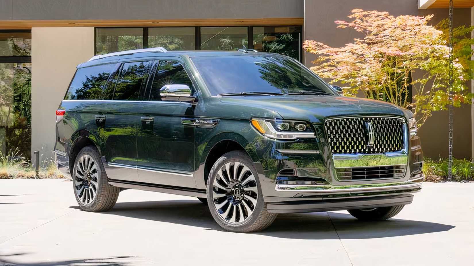 2024 Lincoln Navigator in green parked in front of house