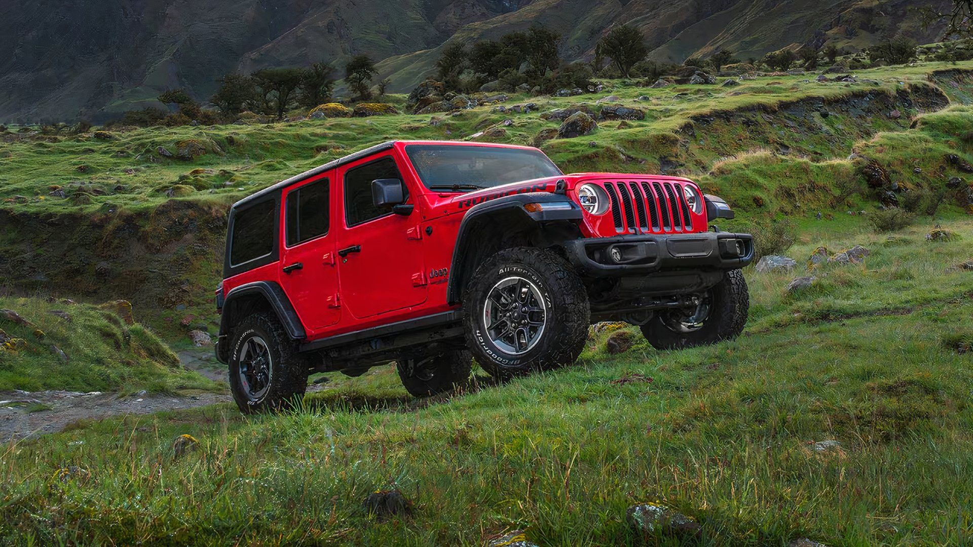 2020 Jeep Wrangler Unlimited Rubicon in red driving off-road