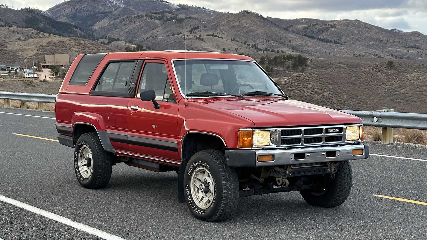 1986 Toyota 4Runner in red driving on road