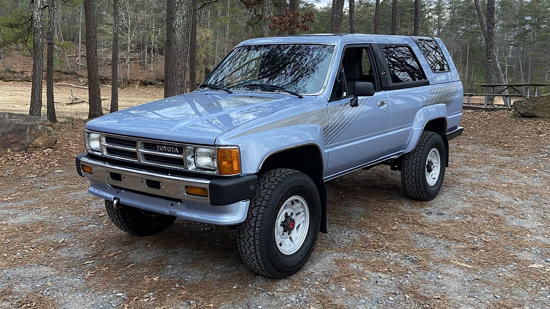 1987 Toyota 4Runner SR5 in blue parked in woods