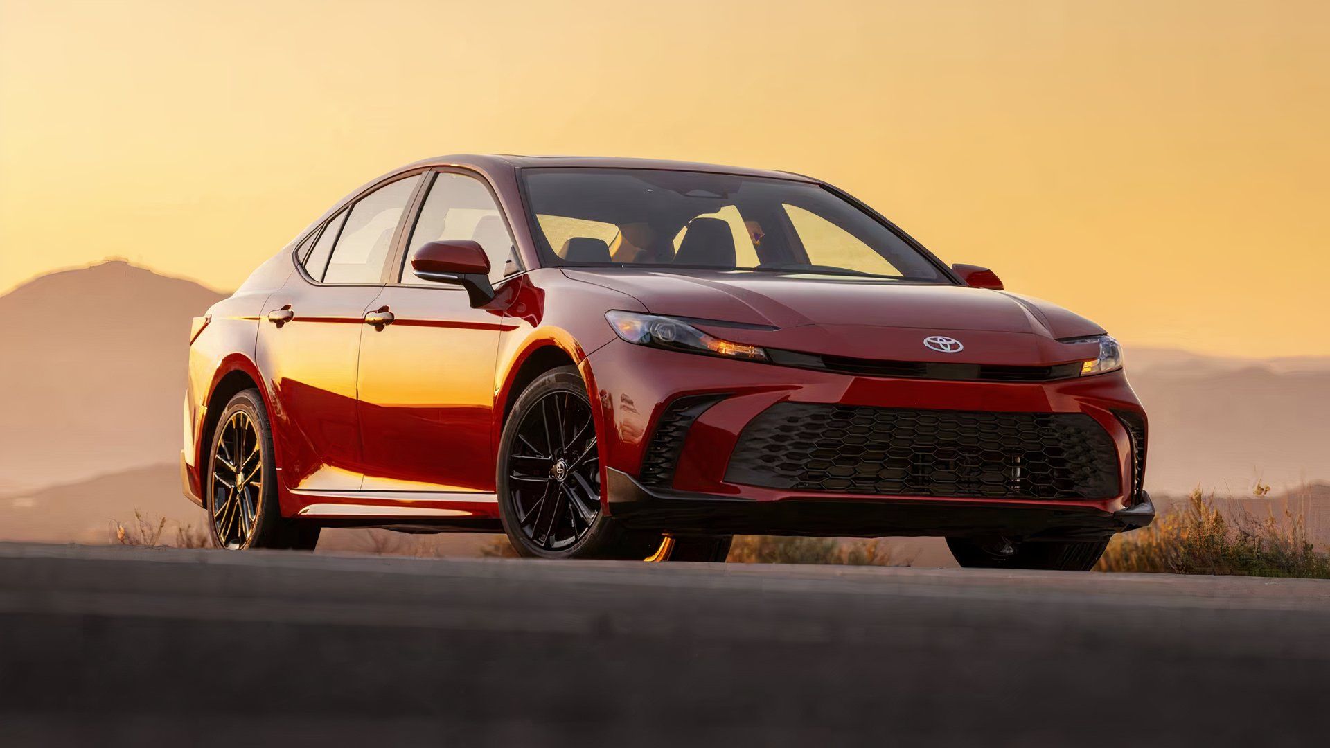 2025 Toyota Camry SE in red parked
