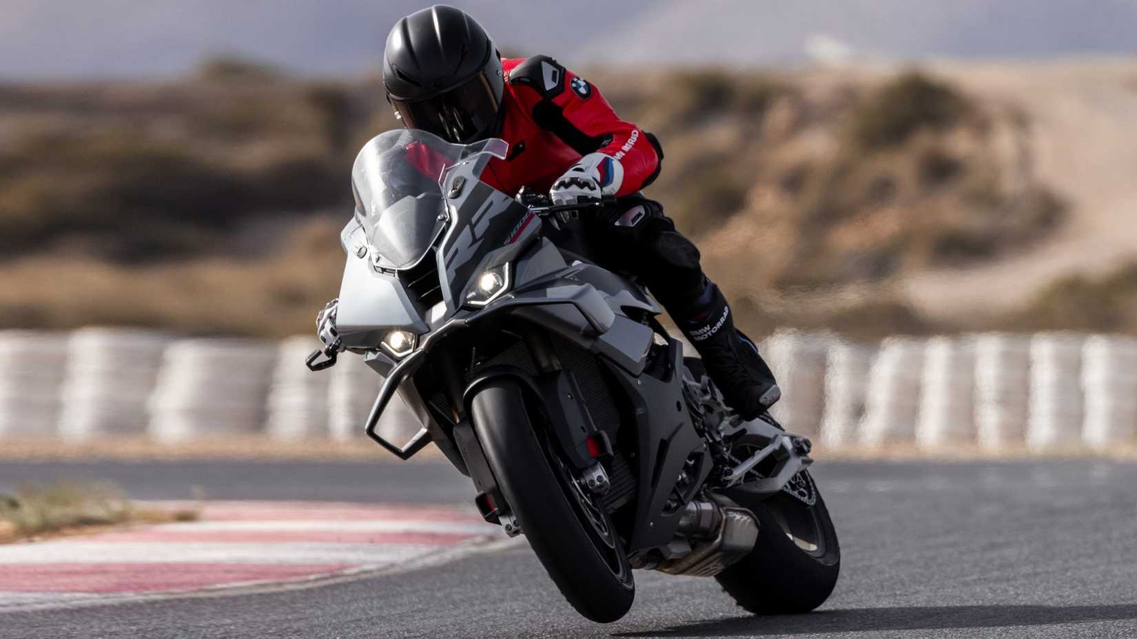 2025 BMW S 1000 RR popping a wheelie hd sports bike wallpaper