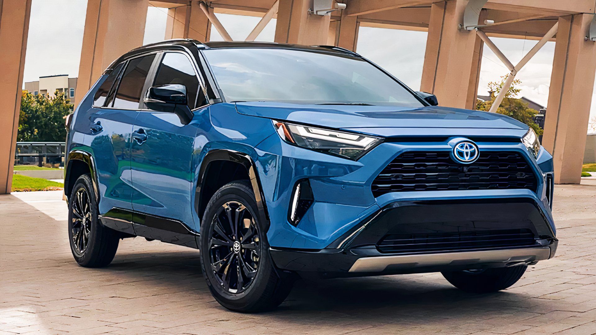 A blue 2022 Toyota RAV4 Hybrid small hybrid SUV is parked. 