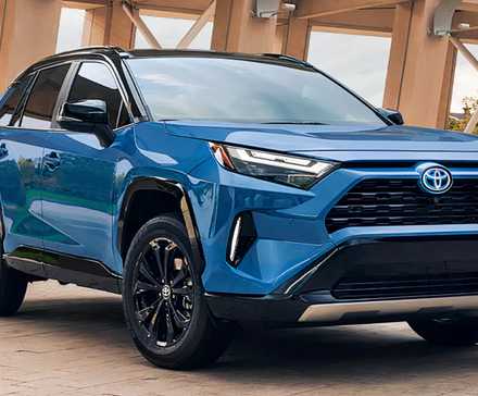 A blue 2022 Toyota RAV4 Hybrid small hybrid SUV is parked.