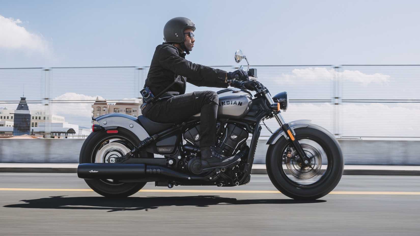 2025 Indian Scout Sixty Bobber on the road accelerating side profile view