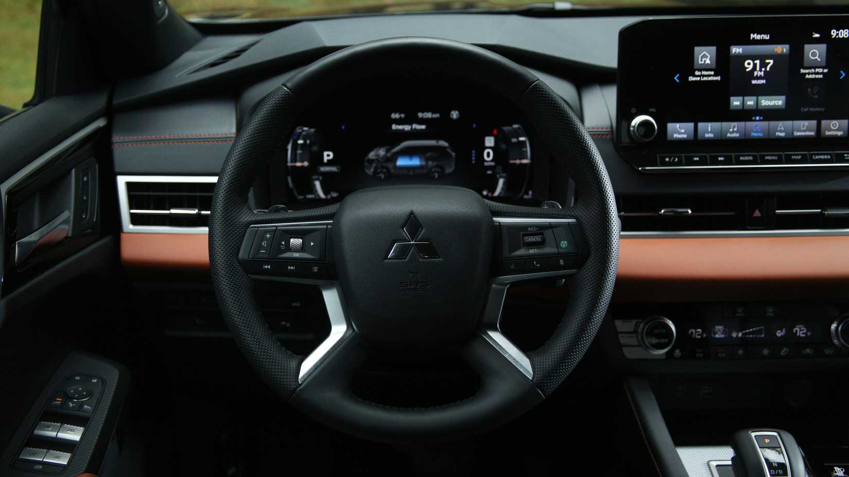2025 Outlander PHEV interior front cabin shot showing steering wheel